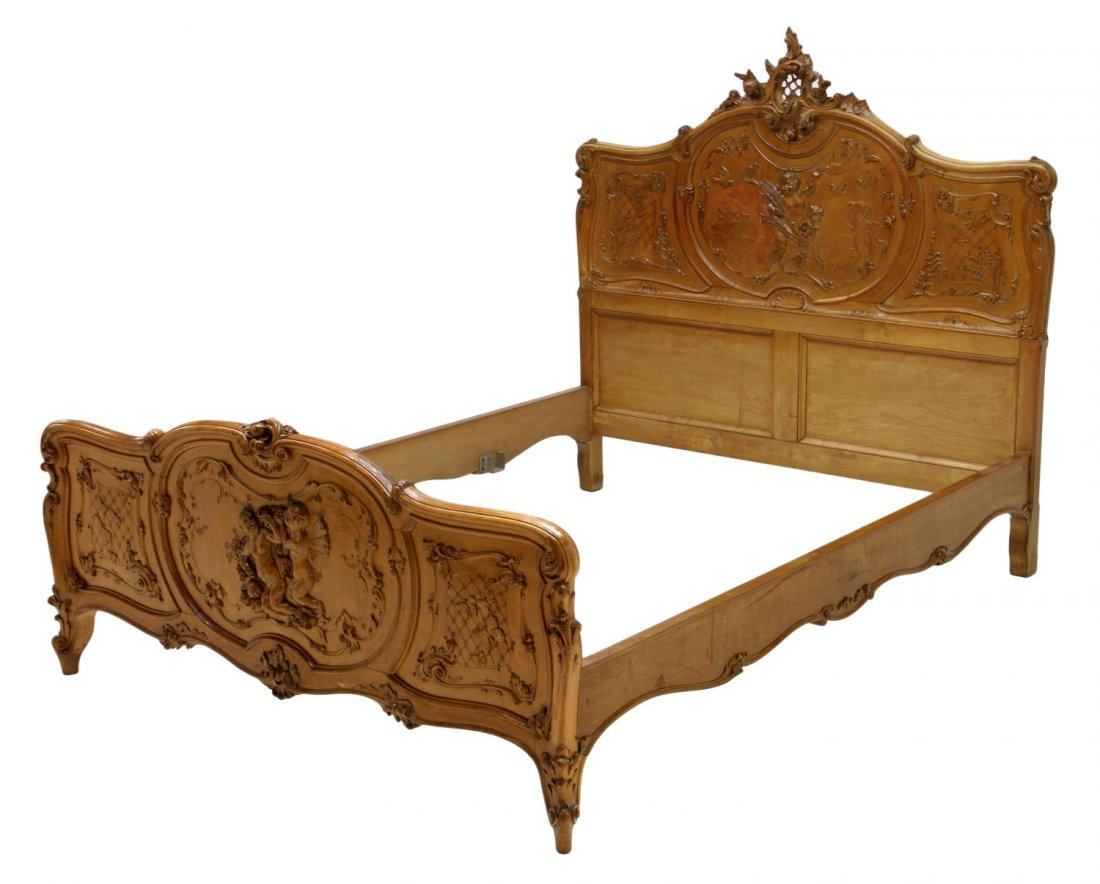 ITALIAN LOUIS XV STYLE FIGURAL CARVED BED: Italian Louis XV style bed, late 19th c., a pierced carved shell crest over the shaped head board with carving including winged putti, birds, dragon flys and foliage, headboard: 58.5"h, 61.75"w, insid