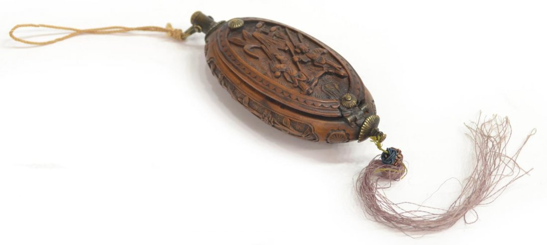 ANTIQUE CHINESE RELIEF CARVED BOXWOOD TRINKET BOX: Chinese carved boxwood container of oval form, probably Qing dynasty, relief carved with warrior figures in a landscape, flanked by sides having foliate vines, the hinged lid unlocking to reveal open