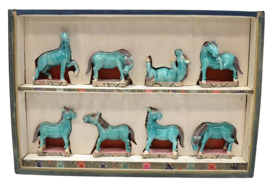 CHINESE GLAZED POTTERY HORSES IN SHADOW BOX FRAME: Chinese wall hanging shadow box, 20th c., eight glazed pottery horses set on two shelves under glass, each in a different pose standing upon a base, some chips, restoration, overall: 11"h, 16"w, 3"d, 
