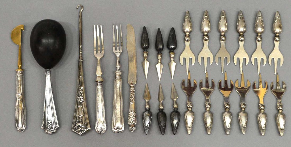 (23)STERLING SILVER DRESSER & SERVICE ITEMS: (lot of 23) Sterling silver service and dresser articles: (12) corn holders with three prongs, (5) single skewer corn holders, (1) sterling handled darning egg, 6"l, (1) button hook, repousse flowers,