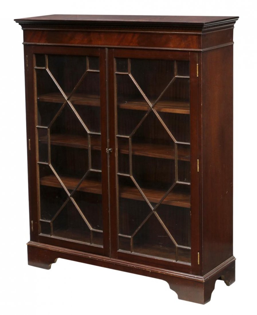 ENGLISH MAHOGANY HALLWAY BOOKCASE: English mahogany hallway bookcase, late 20th c., a protruding top over two astragal faced glazed doors opening to adjustable height shelves, all raised on bracket feet, 47.25"h, 38.5"w, 12"d Start Pri