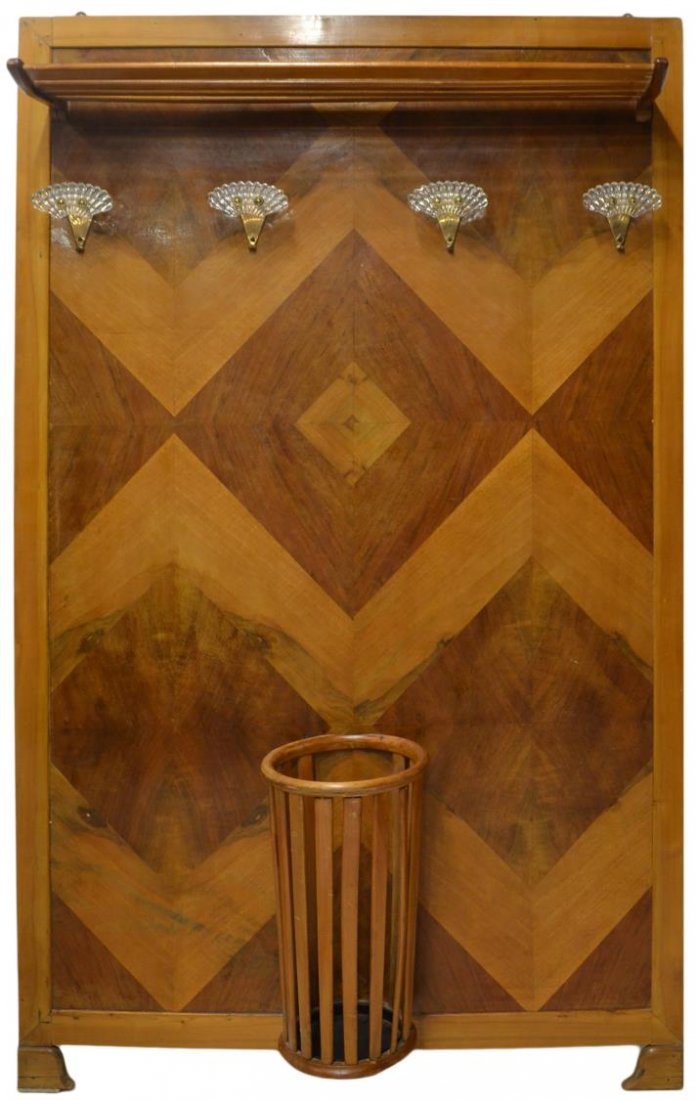 ITALIAN ART DECO PARQUETRY HALL TREE: Italian Art Deco parquetry wall mount hall tree, c. 1925, a shelf over four metal hooks with shell form accents, the parquetry center of contrasting wood with a cylindrical umbrella stand, rising on s