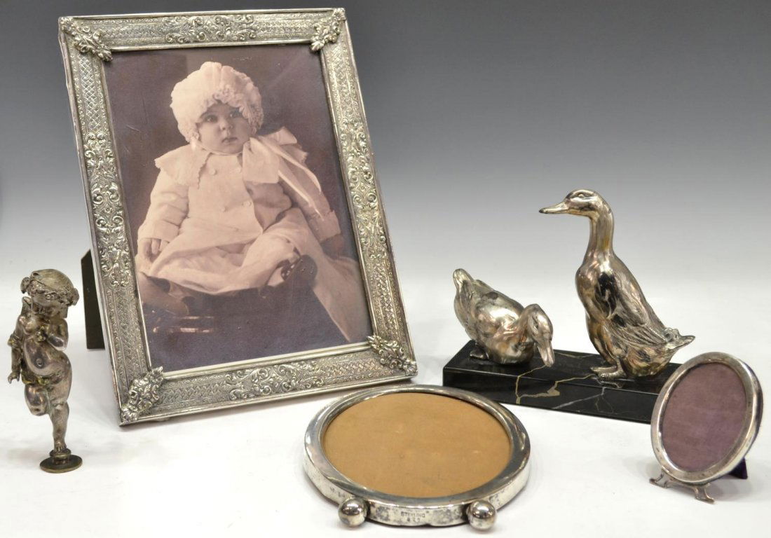 (5) STERLING SILVER & SILVER PLATE CABINET ITEMS: (lot of 5) Collection of sterling silver and silver plate cabinet items, including (2) sterling silver frames, (1) Barbour S.P. Co. frame, (1) silver plate figural finial, modeled as a winged cherub,