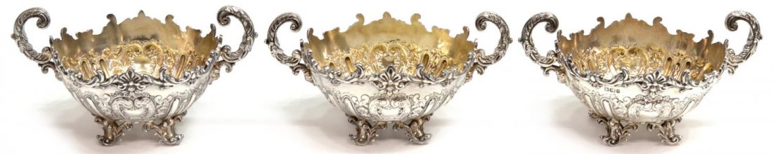 (3)MAPPIN & WEBB SHEFFIELD STERLING SILVER BASKETS: (lot of 3) Ornate Mappin and Webb sterling silver handled baskets / bowls, Sheffield, c. 1895, scrolling vines and floral garland throughout, each raised on four short legs ending in scrolled toes, 3.