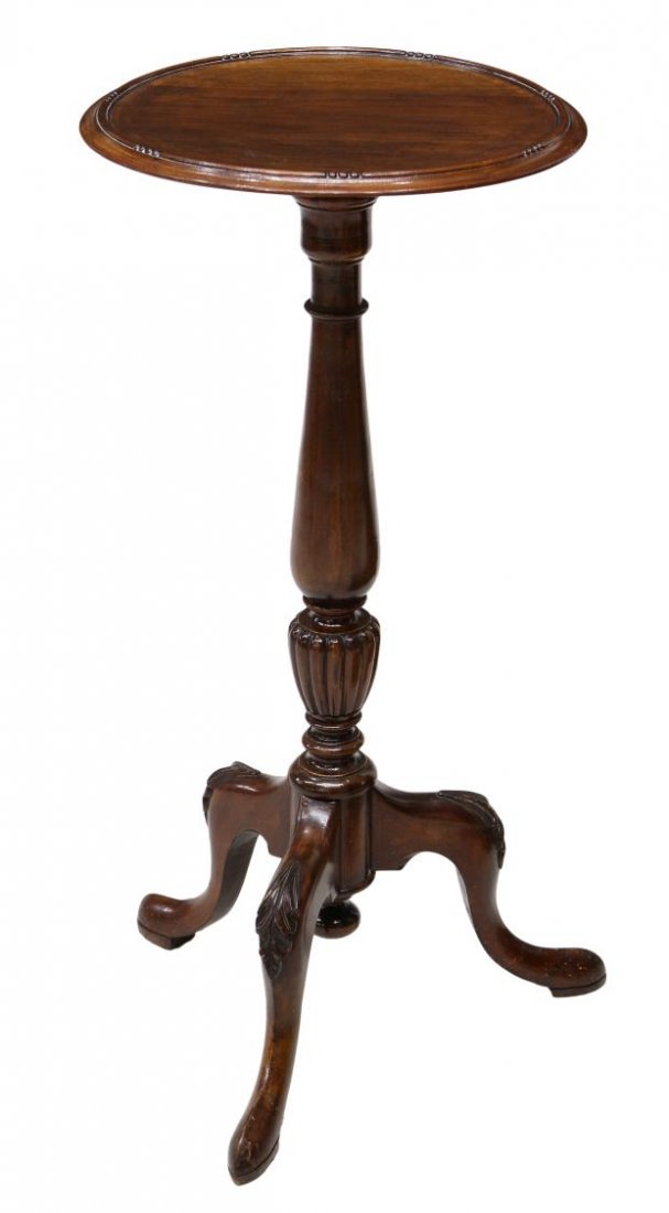 ENGLISH CIRCULAR TOP WINE TABLE: English mahogany dish top wine table, 20th c., having a circular top over the turned pedestal on tripartite legs with snake feet, 29.25"h, 16"w, 15"d Start Price: $80.00