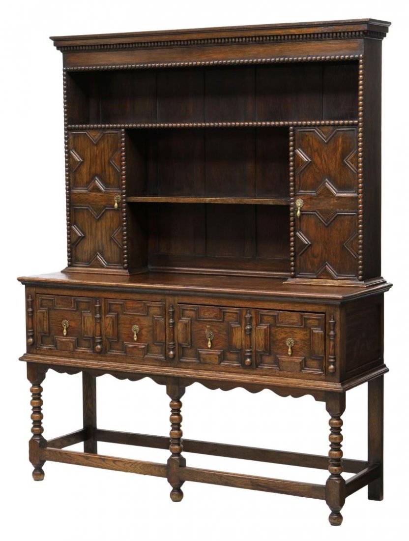 JACOBEAN WELSH STYLE DRESSER: British oak Jacobean Welsh style dresser, 19th c., having a stepped cornice over the shelved two door back, the lower part with two drawers, an open base rising on turned stretcher joined turned spool