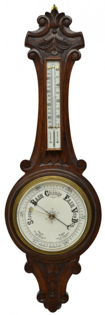 ENGLISH CARVED OAK BAROMETER & THERMOMETER: Victorian foliate carved oak framed barometer, thermometer, both on white porcelain, the thermometer with Fahrenheit and centigrade, the aneroid barometer under brass framed beveled glass, 34.5"h, 11"