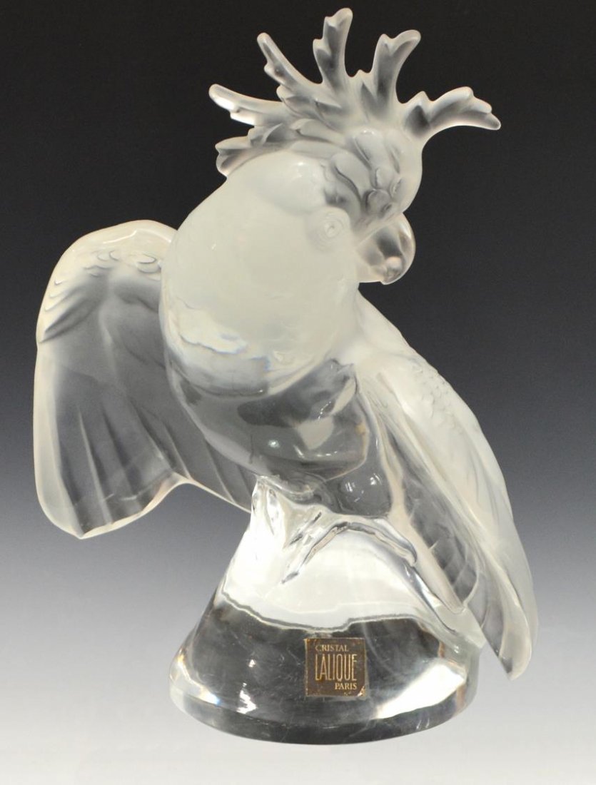 LARGE LALIQUE FRANCE CRYSTAL COCKATOO BIRD: Lalique frosted and colorless molded art crystal Cockatoo, retaining paper label 'Cristal Lalique Paris', perched upon a conical base, surface wear, signed in script Lalique France, 11.75"h, 10" (wing