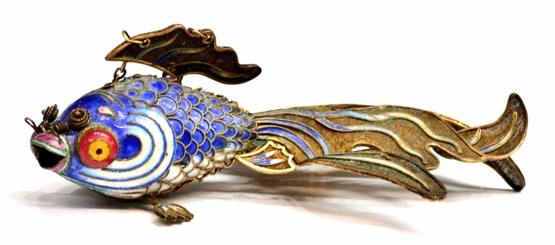 CHINESE SILVER-GILT ARTICULATED FISH: Chinese gilt-silver fish having bright polychrome enamels on an articulated body, a hanging chain on fin, 7"l, .25lb *Provenance: From the estate of noted San Antonio & Austin resident Todd Denman Bur