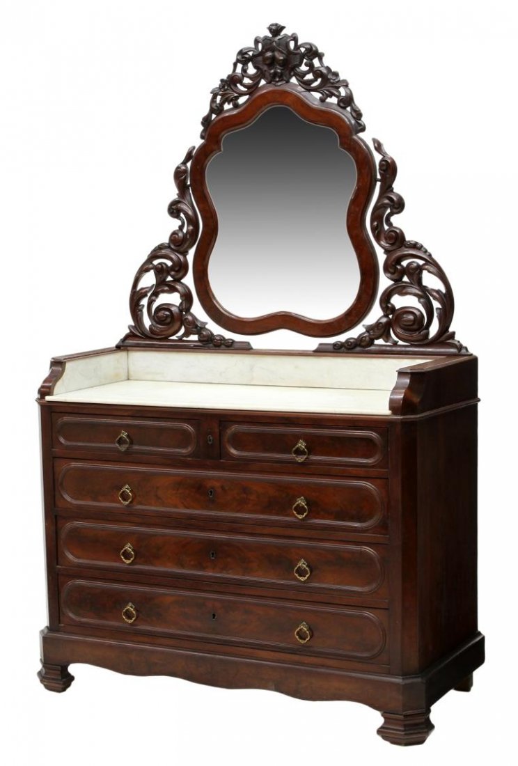 VICTORIAN MAHOGANY MIRRORED MARBLE WASHSTAND: Victorian washstand, late 19th c., having a pierced carved framed tilting mirror over the marble top with splash sides and back, two short drawers over three long drawers lacking locks, rising on angl