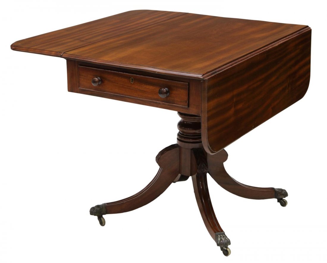 REGENCY MAHOGANY DROP SIDE PEMBROKE TABLE: Regency mahogany table, first quarter 19th c., drop sides with a single drawer at one end, a faux drawer front at the opposite side, rising on a turned pedestal with four down swept legs ending in met
