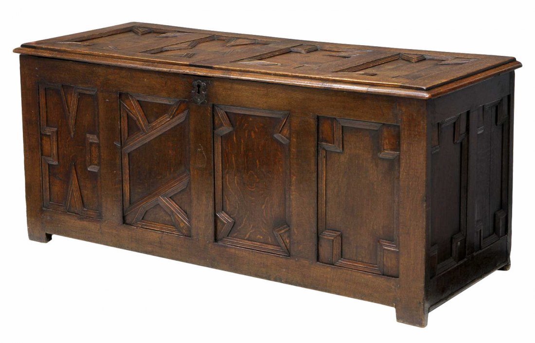 JACOBEAN STYLE 18TH C. BLANKET BOX TRUNK: Jacobean style oak trunk or blanket box, 18th c. with geometric trim at front and top, a hinged lid with original lock, block feet, 25.75"h, 59.5"w, 22.25"d Start Price: $400.00