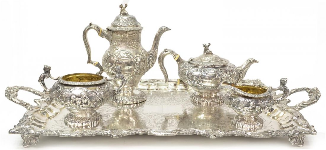 GEORGE III JOSEPH ANGELL STERLING COFFEE SERVICE: (lot of 5) Scarce George III repousse sterling silver tea and coffee service, Joseph Angel, London, Regency period, hallmarked 1818, both kettles are surmounted by a figural finial modeled as a robed 