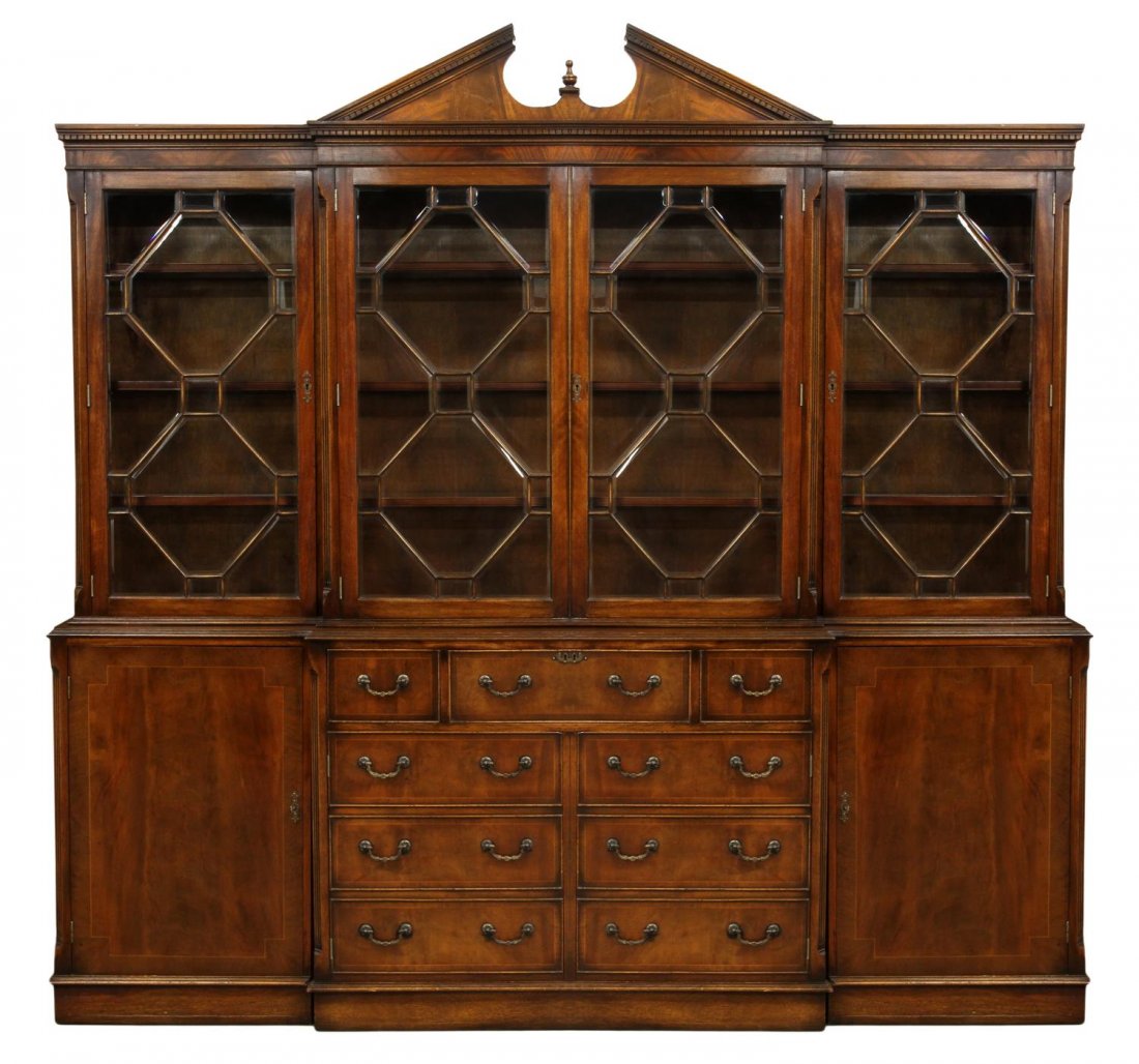 LARGE GEORGIAN STYLE MAHOGANY DISPLAY CABINET: Georgian style mahogany breakfront display cabinet by Dickson of Ipswich, England, 20thc., a split pediment cornice over four astragal faced beveled glass paned doors opening to adjustable shelves, th