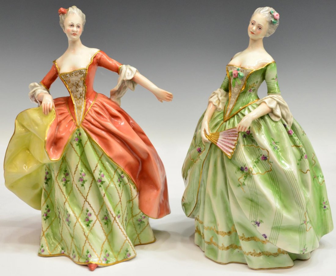 (2) ITALIAN CAPODIMONTE PORCELAIN BEAUTIES: (lot of 2) Italian Capodimonte porcelain figures, modeled as beauties in elaborate parcel gilt dresses with polychrome foliated accents, one holding a fan, crown over 'N' Made in Italy marks underfoot