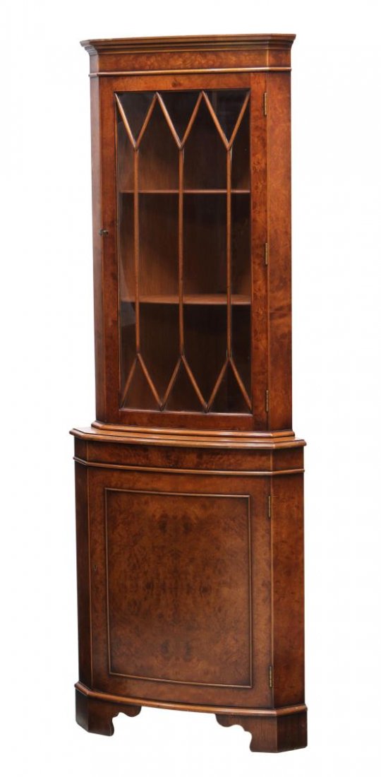 ENGLISH WALNUT CORNER DISPLAY CABINET: English walnut bow front corner display cabinet, 20th c., a stepped cornice over the astragal faced glass door, a door below, rising on bracket feet, 71"h, 25.5"w, 16.5"d Start Price: $150.00
