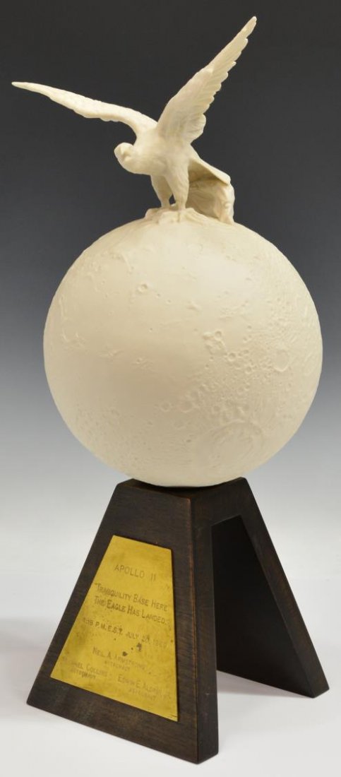 CYBIS COMMEMORATIVE APOLLO 11 LANDING SCULPTURE: Cybis commemorative 'Moon Mission' bisque porcelain sculpture, depicting an eagle perched on top of the world, set on a wood base, base with gilt brass plaque dedicated to Apollo 11 reading "Tranquili