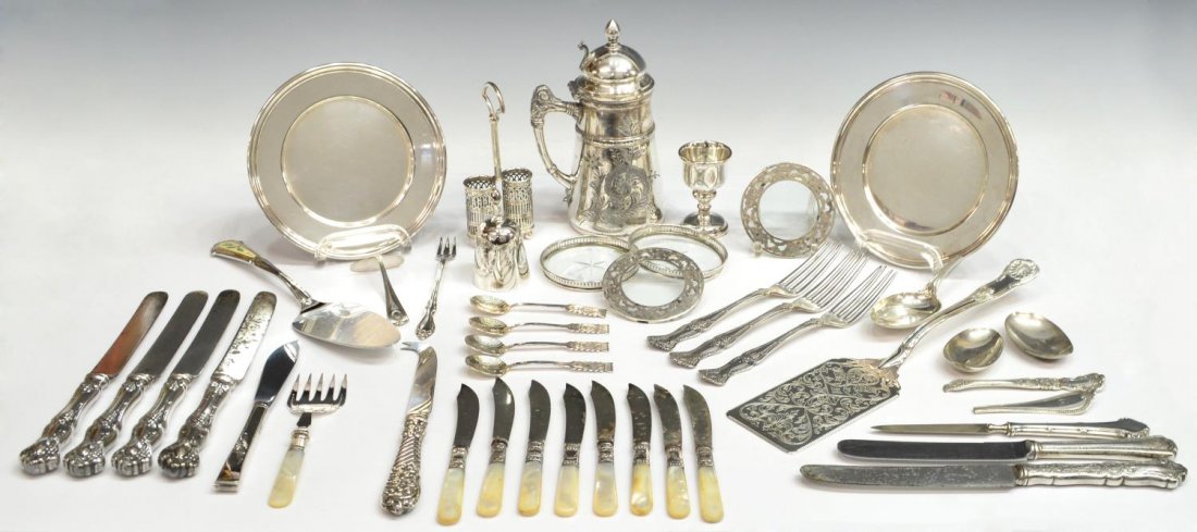 COLLECTION SCRAP STERLING & SILVERPLATE GROUP: (lot) Collection of mostly silver plate serviceware and table items including mother-of-pearl handled flatware, small engraved pitcher, spoons, service spatula, a bell, scrap sterling items that are b