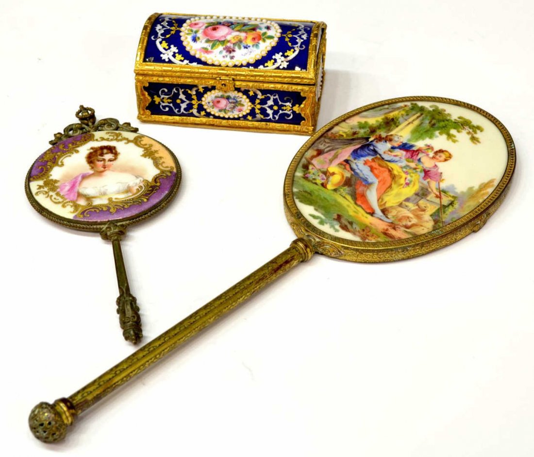 (3) CONTINENTAL DOMED CASKET & PORTRAIT MIRROR: (lot of 5) Collection of Continental dresser articles: (1) hand painted hand mirror, raised gilding centering the portrait of a beauty, beveled mirror plate with loss of silver/wear, 8"l; (1) large tr