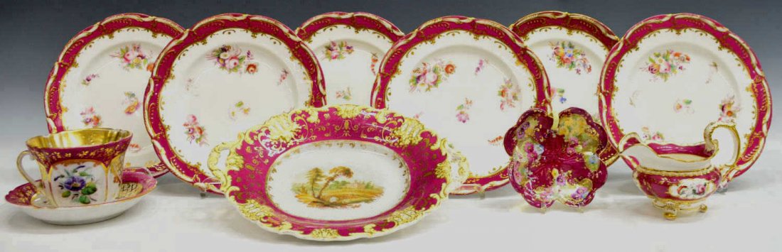 (11) 19TH C ASSEMBLED ENGLISH PORCELAIN DINNERWARE: (lot of 11) Assembled English porcelain dinnerware, early to mid 19th c., polychrome hand painted flowers on a white and cranberry toned ground, gilt accents throughout, comprising: (6) plates, one ma