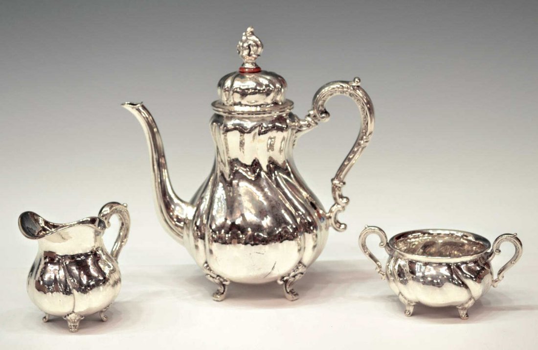(3) DIMINUTIVE GERMAN 835 SILVER COFFEE SERVICE: (set of 3) German 835 silver coffee service, Wilhelm Binder, in a swirl motif, comprising: (1) kettle, 7.5"h; (1) cream pitcher, 2.75"h; (1) sugar, 2.25"h, 4.25"w (handles); 16.58ozt total (inclusive 