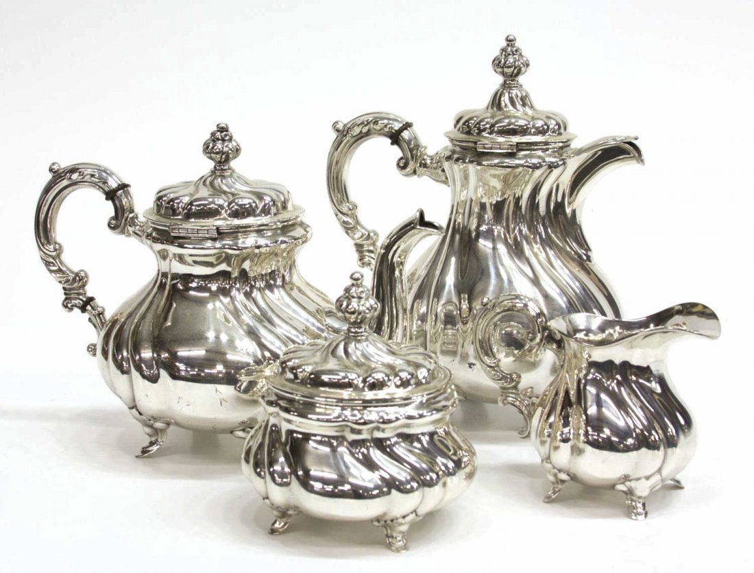 (4) GERMAN 835 SILVER TEA & COFEE SERVICE: (set of 4) German 835 silver tea and coffee service, Bruckmann and Sohne, in a swirl motif, comprising: (1) coffee pot, 10.25"h; (1) teapot, 8.5"h; (1) lidded sugar, 6.25"h; (1) cream pitcher, 4"h; 56