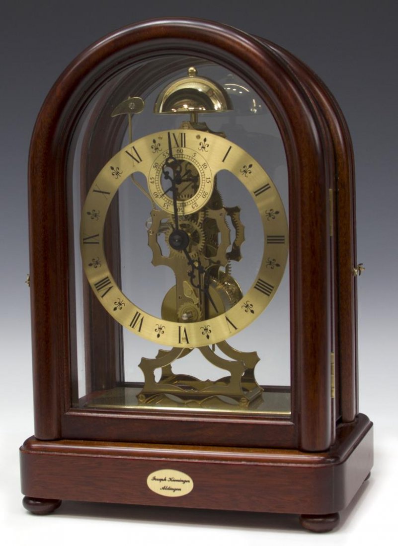 KIENINGER SKELETON CLOCK, OPERATING: Kieninger skeleton clock, Aldingen, Germany, last quarter 20th c., having a mahogany finish framed case, the works finished in brass striking on the hour, operating, 13.5"h, 9.25"w, 6"d, 6lbs Start Pr