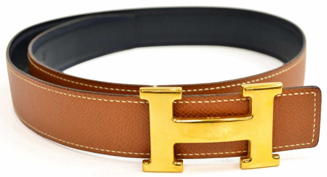 HERMES 'H' GOLD TONE BROWN LEATHER LOGO BELT: Hermes brown leather belt, "H" gold tone buckle, navy blue interior marked and stamped circle Y, 1T2, retaining Hermes box and small dust bag, surface wear to buckle, size 70, .5lb Start Price: $325.0
