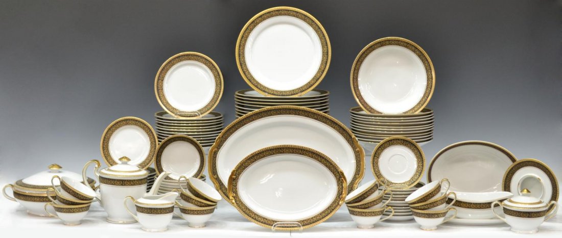 (92) BLACK & GILT PORCELAIN DINNER SERVICE: (set of 92) Hand painted porcelain dinner service for twelve, white well enclosed by a border of gilt decoration on a black ground, comprising: (12) dinner plates, 10.5"diam; (12) salad plates, 7.75"d