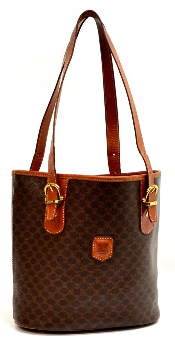CELINE MONOGRAM CANVAS & LEATHER BUCKET PURSE: Celine shoulder bag in monogrammed canvas, leather handles and trim, gold tone hardware, interior with single zipper pocket dividing two compartments, marks to interior, bag: approx 9.5"h, 13"w, 5.5"d