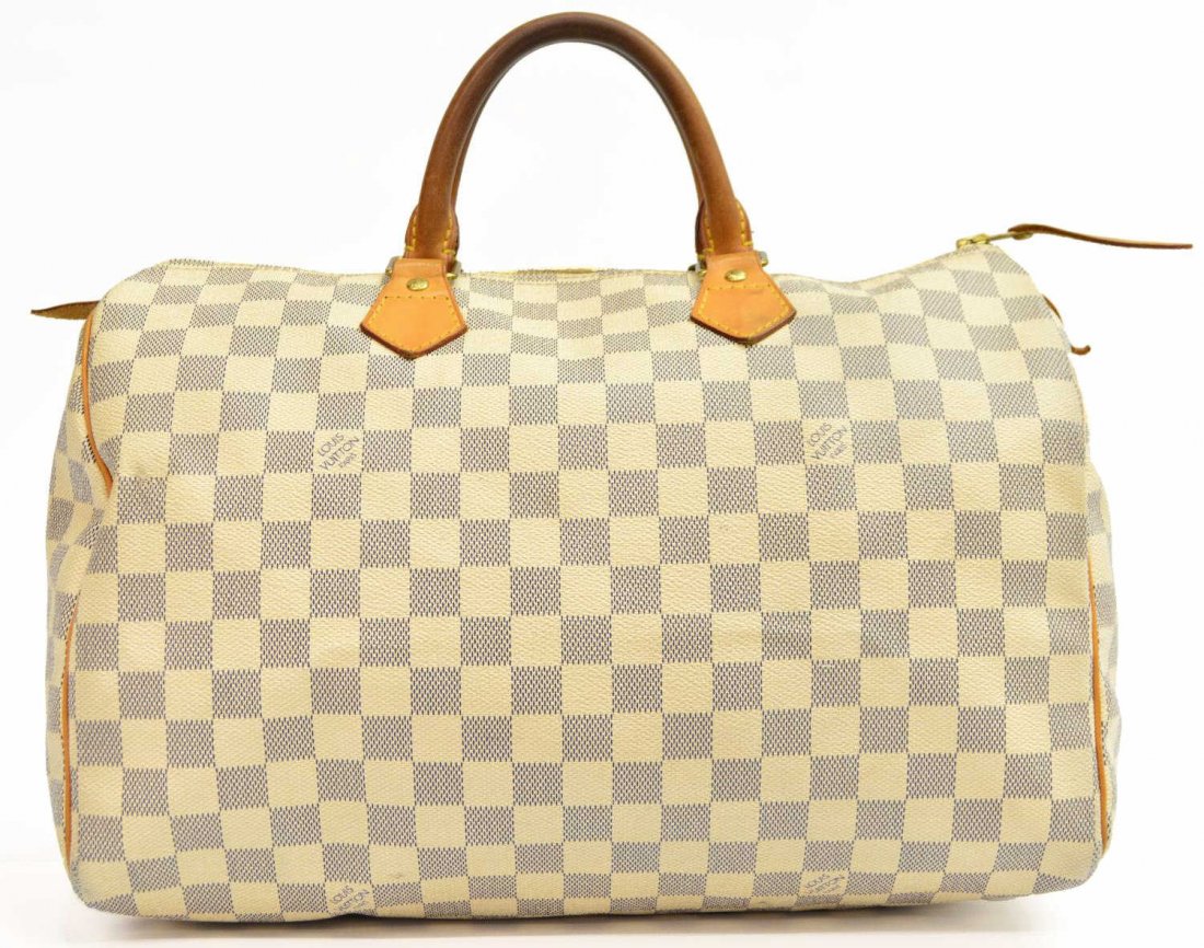 LOUIS VUITTON DAMIER SPEEDY 35 CANVAS HANDBAG: Louis Vuitton "Speedy 35" handbag in Damier canvas, natural leather handles and trim, single slot pocket interior, discoloration to handles, marks to interior as pictured, 9"h, 14"w, 7.5"d, 1lb Start 