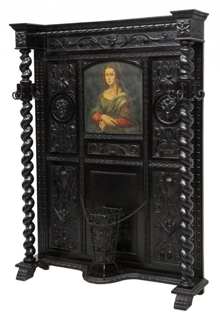 SPANISH HALL TREE WITH CENTRAL OIL PAINTING: Spanish ebonized hall tree, Barcelona, c. 1900, twist iron rods connect large vertical twist columns, with coat hooks, flanking panels of carved masks and foliage, with a wrought iron umbrella stand, 