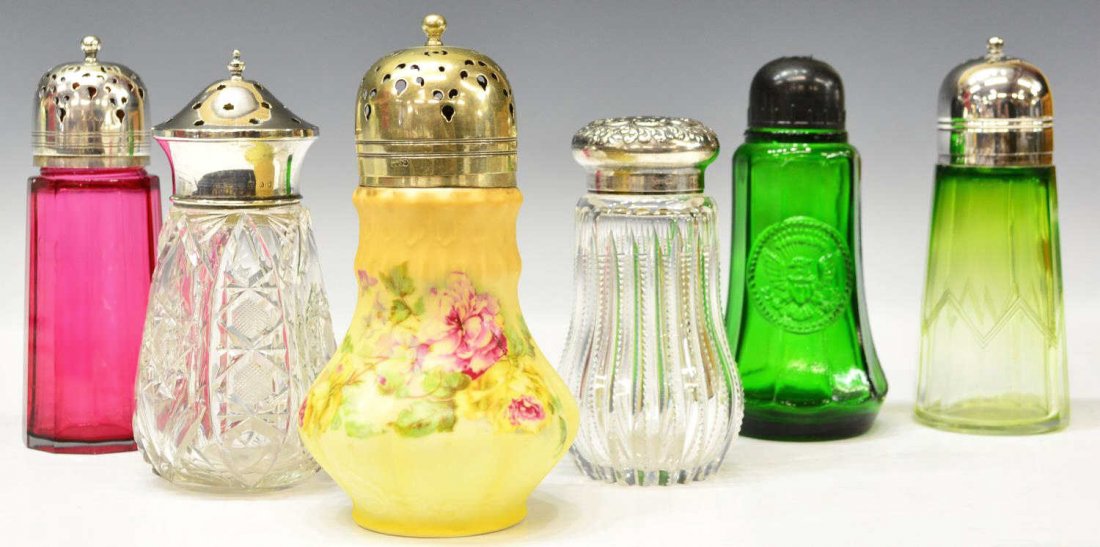 (6) ASSORTMENT OF COLORED & CLEAR GLASS SHAKERS: (lot of 6) Collection of colored glass and porcelain shakers, varying sizes and colors including emerald, ruby, clear and more, some with silverplate and Sterling caps, largest: 6"h, 3.25"w, 3lbs tota