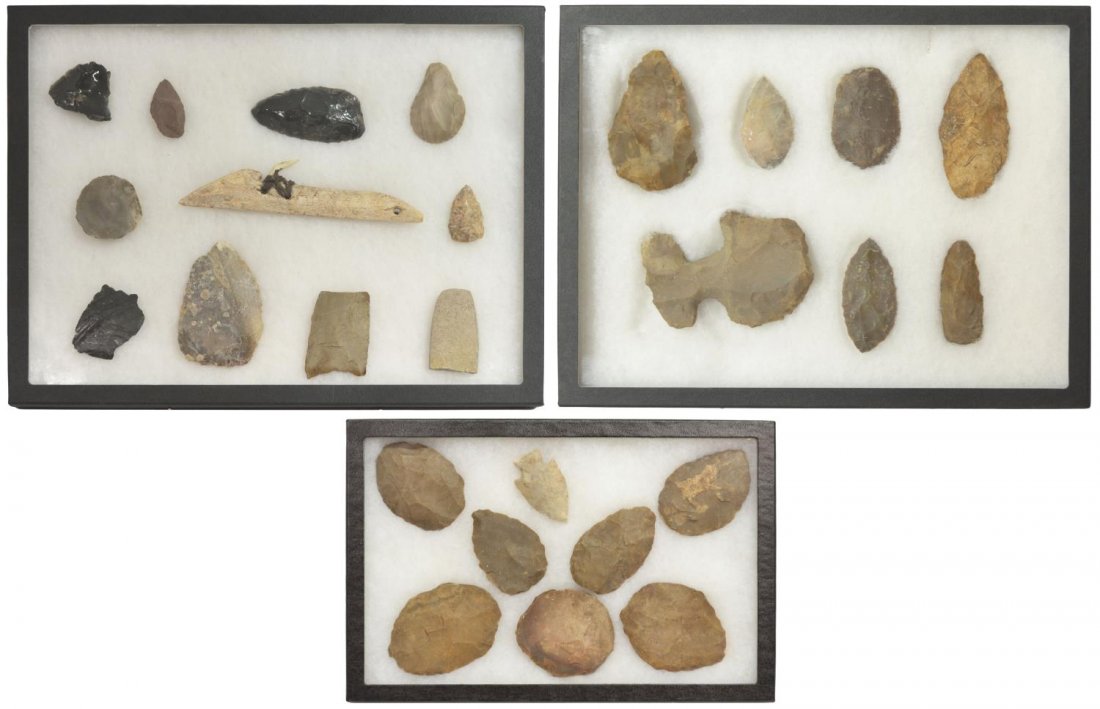 (26) AMERICAN INDIAN, AXE, SCRAPERS, OBSIDIAN: (lot of 26) Native American tools including axe head, arrowhead, scrapers, flaked obsidian, fish hook connected to wood with rawhide,housed in Riker display boxes, largest: 16.5"x13.25"x.75", total we