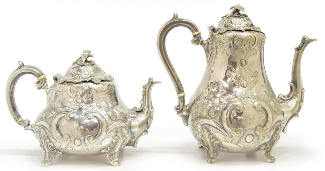 (2)ENGRAVED & RELIEF DECORATED SILVERPLATE KETTLES: (lot of 2) Silver plate tea and coffee pots, matching patterns and monograms, raised floral motif, bird form finial, mark as pictured, largest: 9.5"h, 5lbs total Start Price: $40.00