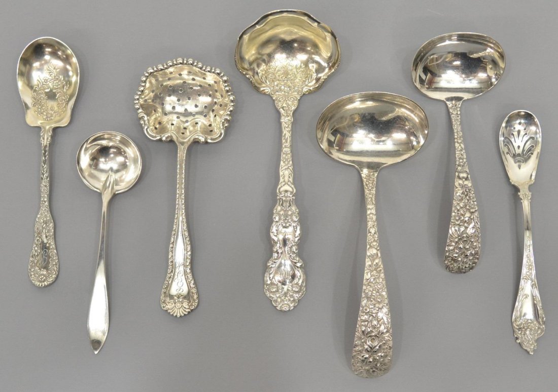 (7) COLLECTION STERLING SILVER SERVICEWARE, STEIFF: (lot of 7) Assorted sterling silver serviceware, all monogrammed either to the front or back: (2) Steiff repousse floral design ladles, largest: 6.5"l; (1) Gorham sterling ladle, 6.75"l; (1) pierced s