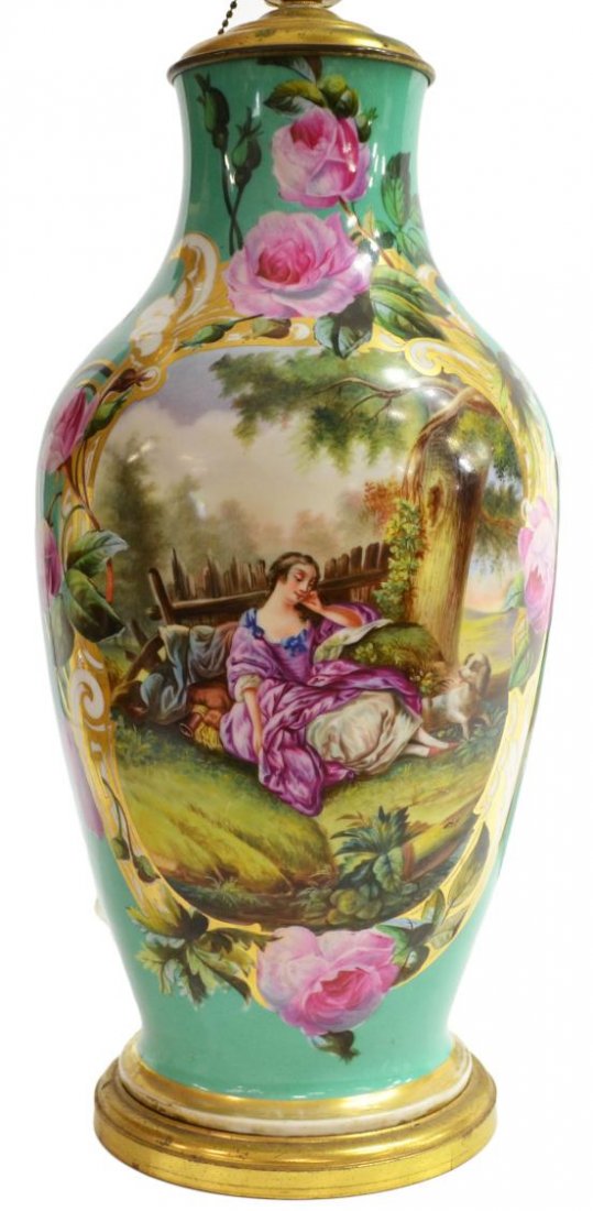 CONTINENTAL HAND PAINTED PORCELAIN URN TABLE LAMP: Continental porcelain urn, now mounted as a table lamp, in the Old Paris taste, central hand painted reserve of a formally dressed woman lounging outside with her dog, enclosed by a border of rose vin