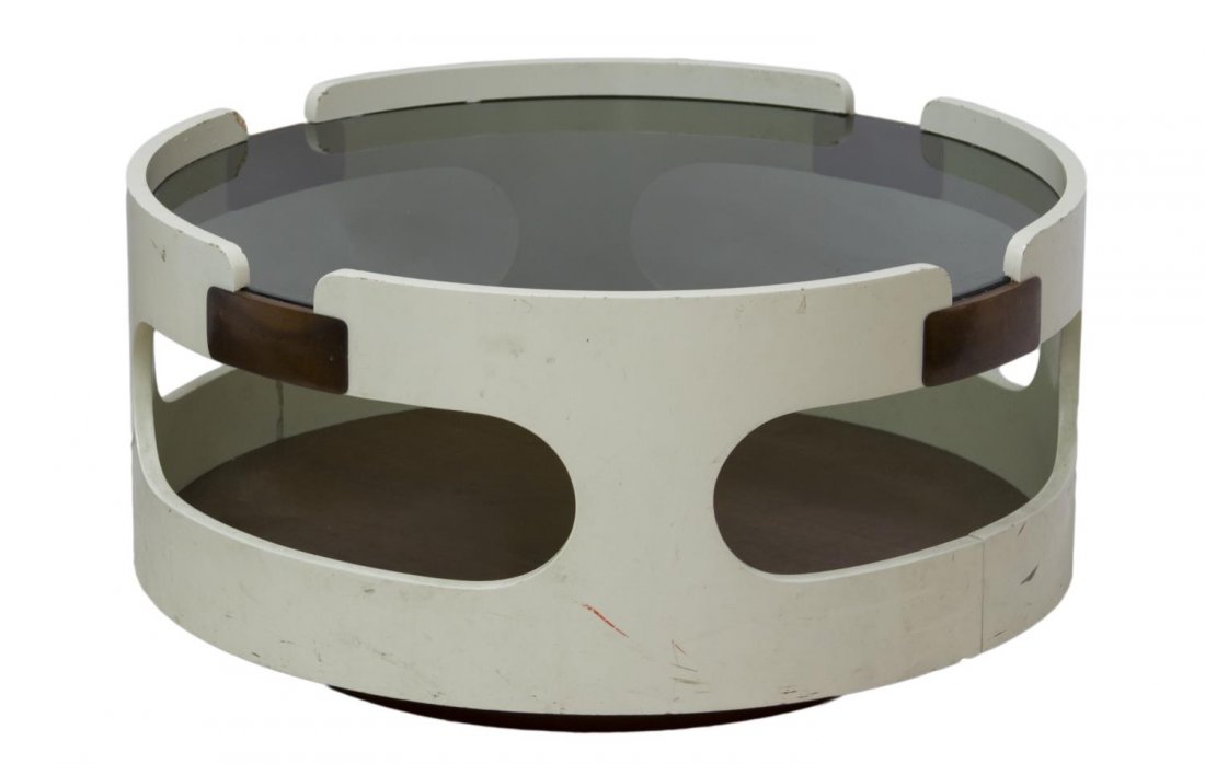 ITALIAN MID-CENTURY MODERN CIRCULAR COFFEE TABLE: Italian mid-century modern glass top coffee table, the circular frame in white paint with oval cutouts, 14"h, 28"diameter Start Price: $100.00