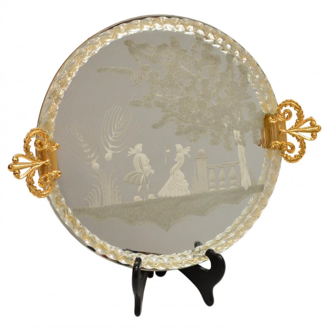 CONTINENTAL FIGURAL ETCHED GLASS PLATEAU MIRROR: Continental circular table mirror, probably Italy, gilt metal handles on the circular tray, bordered by twisted glass trim, etched central figural scene, 17.25"diam (to handles), 4.25lbs Start Price: 