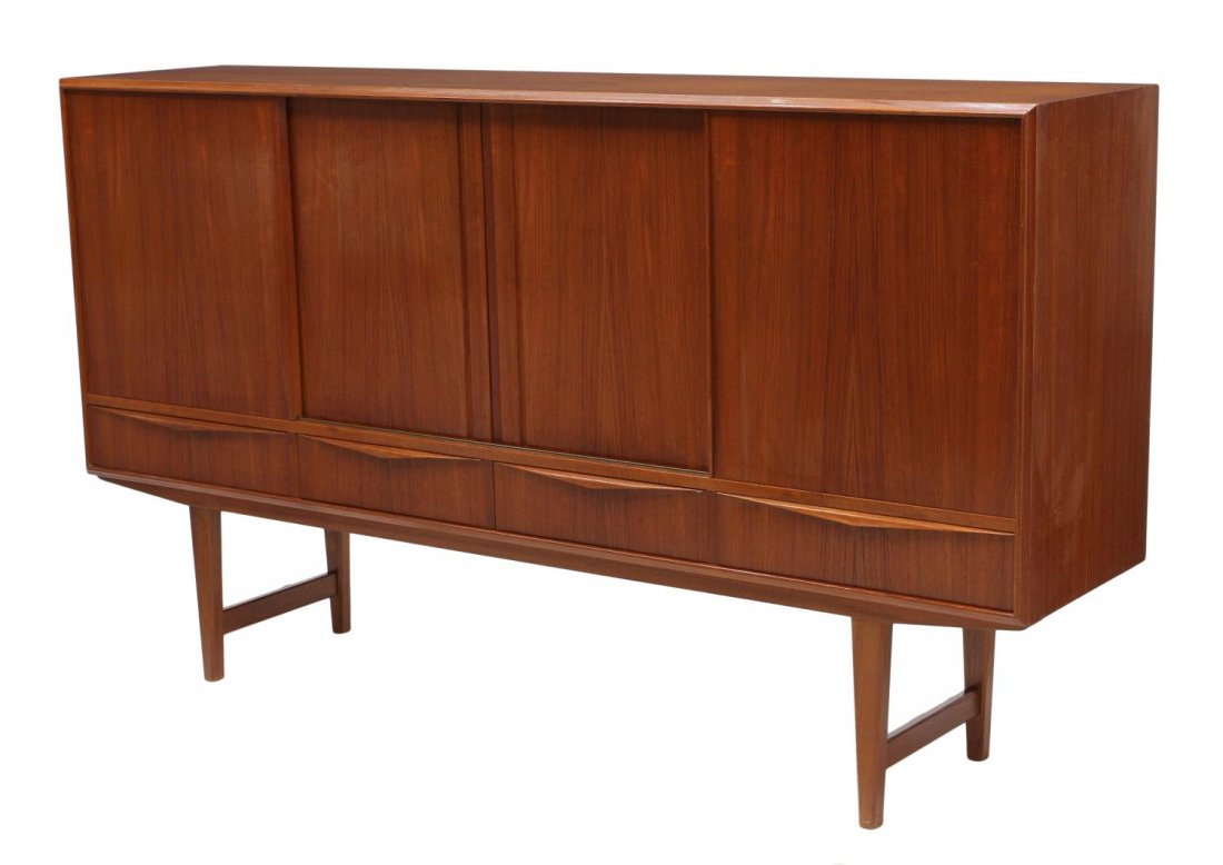 DANISH MID-CENTURY MODERN TEAKWOOD SIDEBOARD: Danish mid-century modern teakwood sideboard, four sliding doors opening to shelves, mirror and two drawers, four lower exterior drawers, rising on stretcher joined tapered legs, 44.25"h, 77.25"w, 17.
