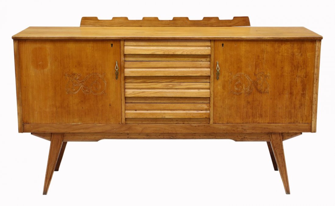 ITALIAN MID-CENTURY MODERN SIDEBOARD: Italian mid-century modern birch finish sideboard having a short scalloped back rail, four central drawers flanked by doors with incised foliate design, rising on angled tapered legs, 37"h, 63.5"l, 18