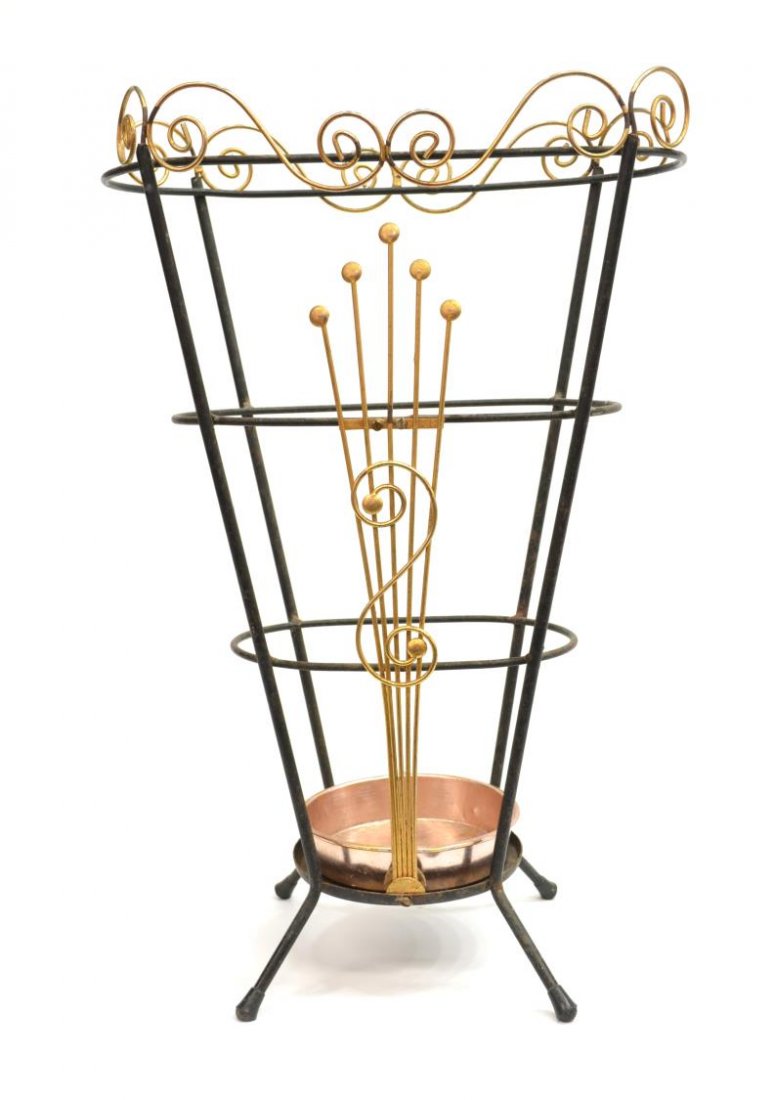 ITALIAN GILT & BLACK METAL UMBRELLA STAND: Italian gilt and black metal umbrella rack, c. 1950's, scroll designs along rim and front panel, on four rounded feet, gilt loss and natural wear, 21"h, 14"w Start Price: $50.00
