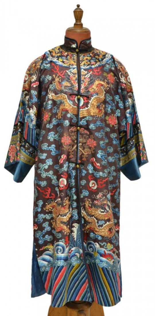 CHINESE BROWN SILK ROBE, COUCHED GOLD DRAGONS: Chinese brown silk robe, 20th c., with decoration of eight dragons of couched gold thread amid multicolored silk embroidered decoration, all above a lishui border band, approx 47"l, 33"w (bottom),1.5 