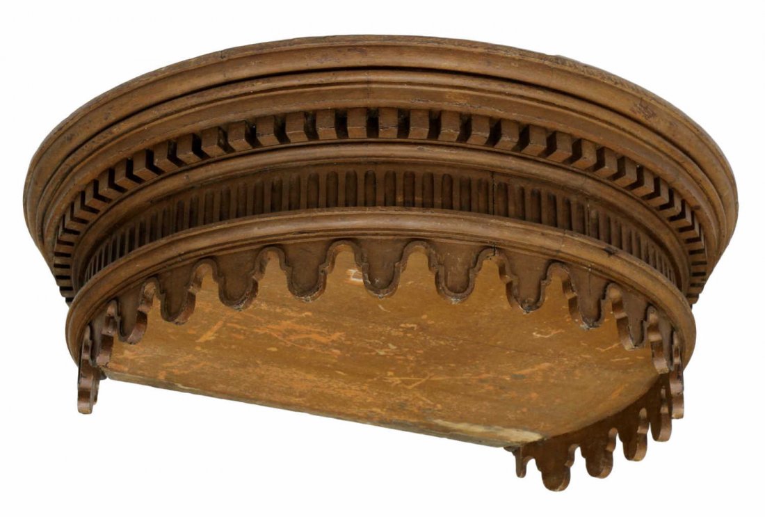 ANTIQUE CARVED WOOD CANOPY BED CROWN: Carved wood architectural element used as canopy bed crown, 19th c., a stepped cornice over dentil molding to a fluted frieze over suspended pendants, approx 11"h, 37.25"w *Provenance: From the estate