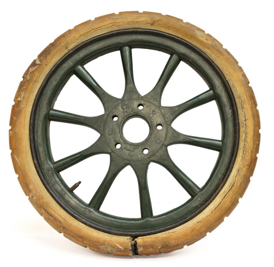 ANTIQUE WHEEL WITH SPOKES & RUBBER TIRE: Antique wheel with rubber tire, green wooden spoke, wear to paint and rubber, tire with tear as pictured, 28"diam, 31lbs total Start Price: $50.00