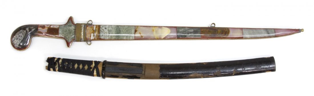 (2) WAKIZASHI SHORT SWORD & MOROCCAN SWORD: (lot of 2) Edged weapons: (1) Japanese short sword or wakizashi, the blade without markings at tang, the handle possibly with ray skin and bat symbol at both sides, lacquered wood sheath with finish l