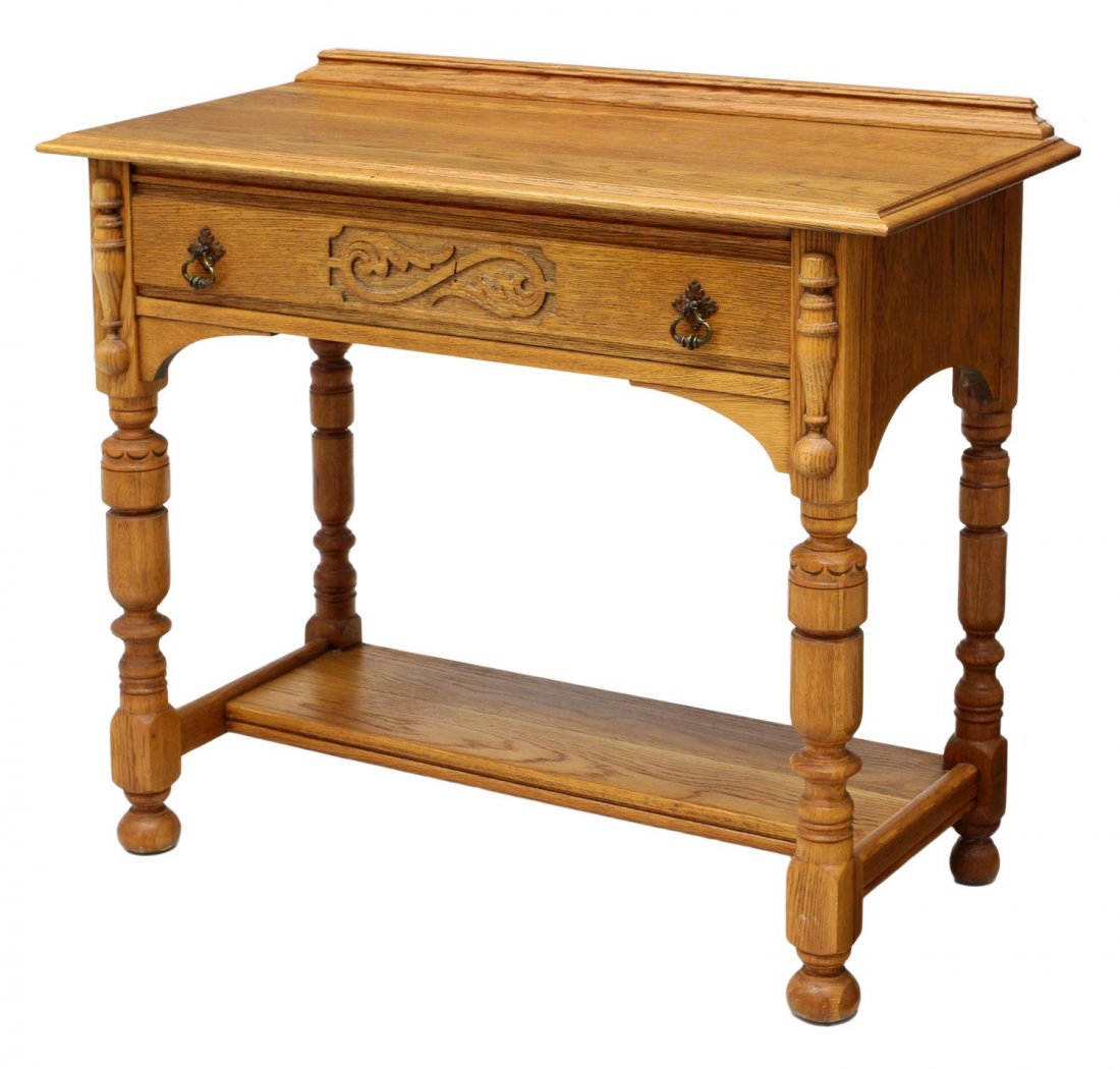 AMERICAN GOLDEN OAK SERVER: American oak server, c. 1910, a short back rail over the rectangular top with a single frieze drawer having pressed carving, four turned legs joined by a lower shelf, all rising on bun feet, 34.5"h, 4