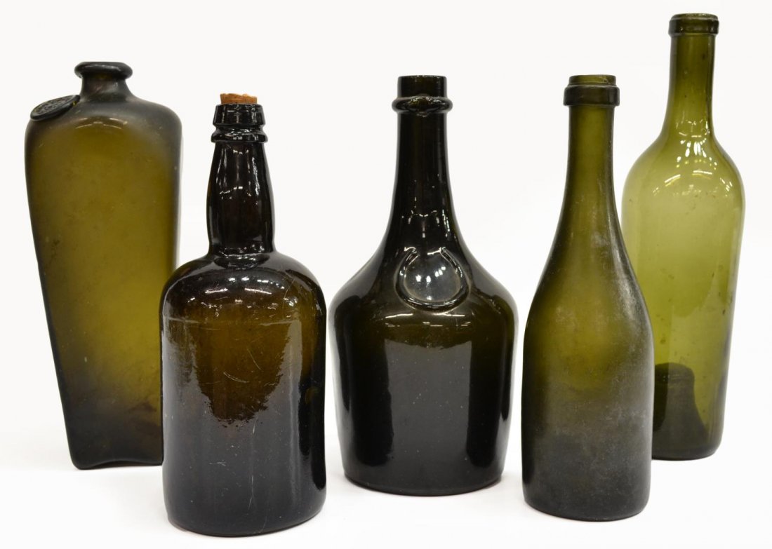 (5) GROUP OF ANTIQUE CONTINENTAL GLASS BOTTLES: (lot of 5) Collection of Dutch and other glass bottles, 18th/19th c., in varying sizes and glass colors, one with applied seal marked Van den Bergh and Co., tallest: 12"h, 7.75lbs total *Provenance: F