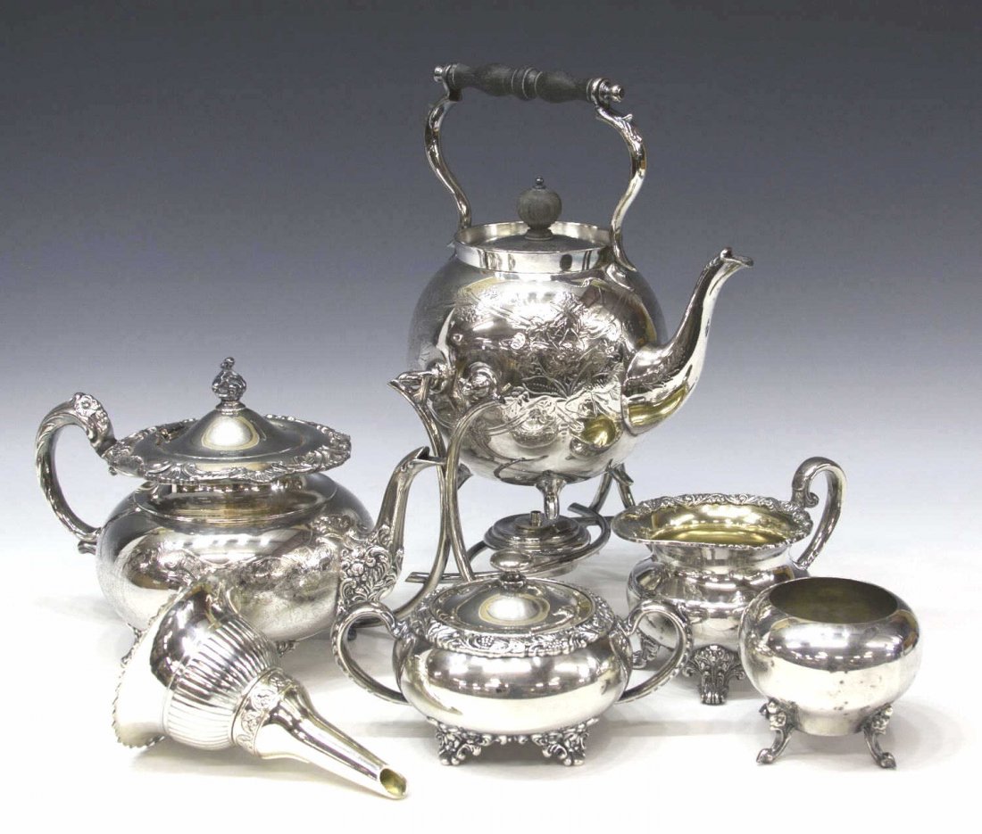 (6) SILVERPLATE SERVICE ITEMS: (lot of 6) Collection of silverplate service items, comprising: (1) tea kettle on stand, wooden handle, slight foliate relief, marked as pictured, 13.25"h; (1) tea pot of squat form resting on four fe