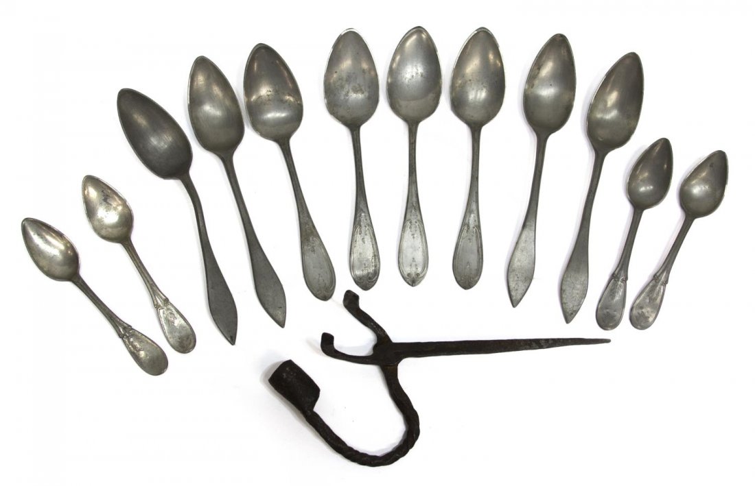 (13)ANTIQUE IRON CANDLE TOMMY STICK, PEWTER SPOONS: (lot of 13) A primitive antique iron candle Tommy stick and trimmer, 8.25"l; together with (12) varied pewter spoons, four monogrammed on reverse, with bending, four with slight design, remnants of ma